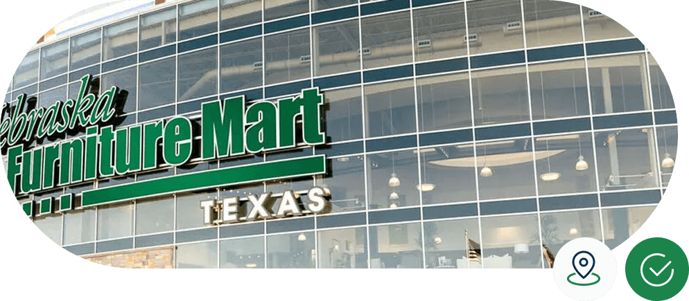 Exterior of Nebraska Furniture Mart Texas store, featuring large glass windows and prominent green signage.