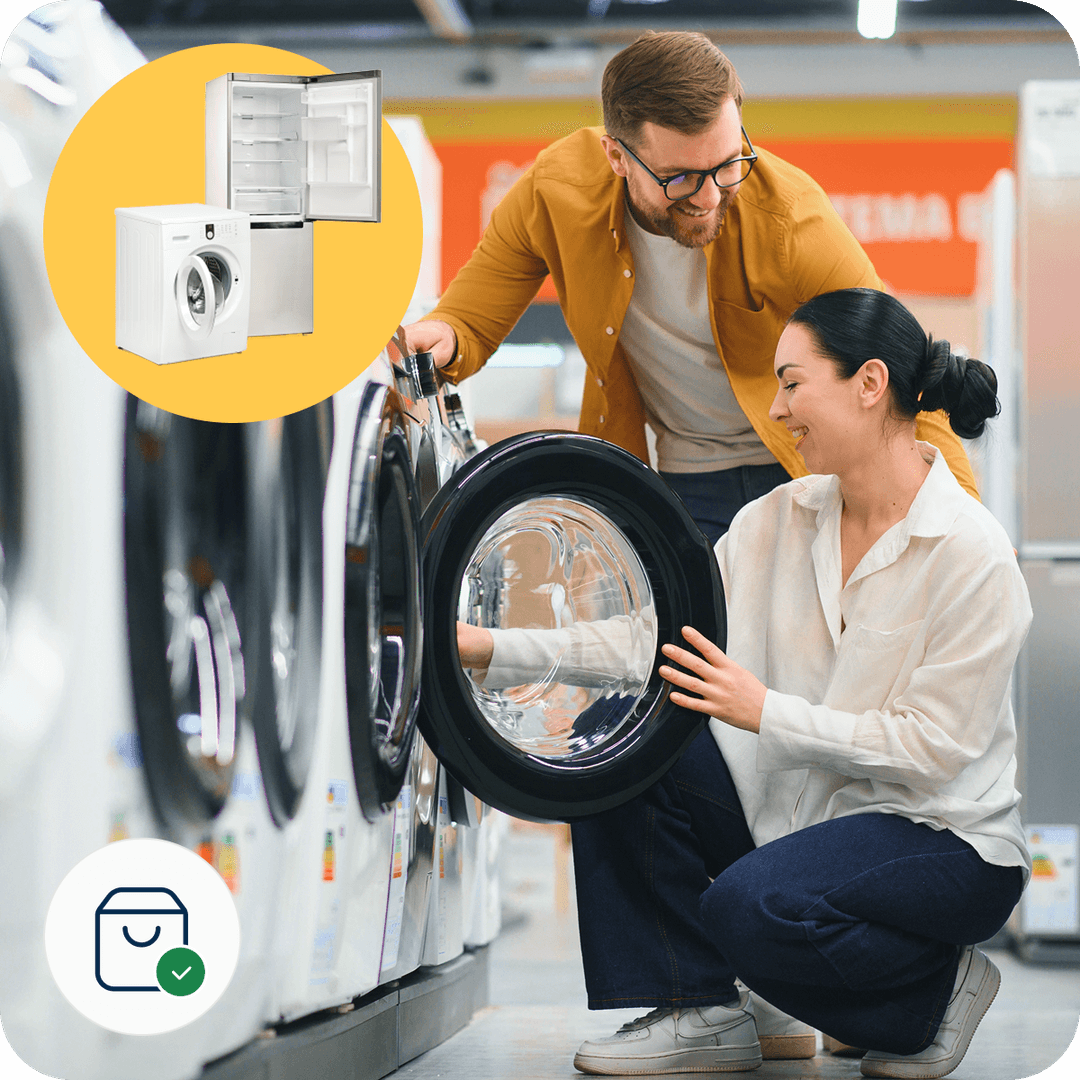 A couple happily examines a washing machine in an appliance store, with an inset of a fridge and washer above them.