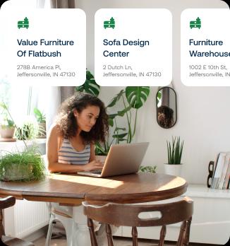 A woman looking at her laptop at a dining table. Overlaid are three cards showing different stores to shop at.